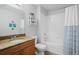 A full bathroom features a wood cabinet, granite countertop, and a shower-tub combination at 700 S Harbour Island Blvd # 547, Tampa, FL 33602