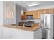 Stylish kitchen featuring granite countertops, stainless steel appliances, and a modern breakfast bar at 700 S Harbour Island Blvd # 547, Tampa, FL 33602