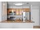 Well-lit kitchen featuring granite countertops, stainless steel appliances, and stylish pendant lighting at 700 S Harbour Island Blvd # 547, Tampa, FL 33602