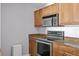 Modern kitchen with stainless steel appliances, granite countertops, and stylish wood cabinetry at 700 S Harbour Island Blvd # 547, Tampa, FL 33602