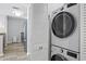 Laundry area features a stackable washer and dryer next to a closet, with kitchen in the background at 700 S Harbour Island Blvd # 547, Tampa, FL 33602