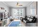 Relaxing living room with a balcony, ceiling fan, stylish decor, seating area with comfortable seating, and a blue accent rug at 700 S Harbour Island Blvd # 547, Tampa, FL 33602