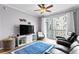 Inviting living room with balcony access, ceiling fan, modern furniture, and a bright blue rug adding a touch of color at 700 S Harbour Island Blvd # 547, Tampa, FL 33602