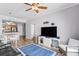 View of the living room featuring a flat-screen TV, modern shelving, and seamless access to the kitchen at 700 S Harbour Island Blvd # 547, Tampa, FL 33602