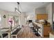 Open living space featuring a dining area, kitchen bar, and a view to the living room at 7288 Castleberry Ter, Englewood, FL 34224