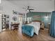 Serene bedroom featuring modern decor, stylish accents, and a relaxing ambiance at 7508 W Short Rd, Plant City, FL 33565