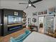 Stylish bedroom with modern design, a sleek TV, and views into a spa-like bathroom at 7508 W Short Rd, Plant City, FL 33565