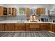 Well-appointed kitchen with custom cabinets, granite countertops, and modern appliances at 7508 W Short Rd, Plant City, FL 33565