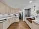 Spacious kitchen featuring custom cabinetry, granite countertops, and an open layout at 7508 W Short Rd, Plant City, FL 33565
