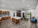 Open kitchen and living room area with modern fixtures and plenty of room at 7508 W Short Rd, Plant City, FL 33565