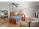 Bedroom with hardwood floors, reading nook, and a ceiling fan at 7615 S Fitzgerald St, Tampa, FL 33616