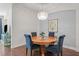 Dining Area with wood table, upholstered chairs, chandelier and decorative accents in an alcove at 7615 S Fitzgerald St, Tampa, FL 33616