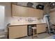 Well-organized garage with custom cabinets and ample storage space at 7615 S Fitzgerald St, Tampa, FL 33616