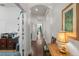 Long hallway features wood floors, recessed lighting, and an arched ceiling at 7615 S Fitzgerald St, Tampa, FL 33616