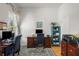 Bright office space featuring hardwood floors, a blue area rug, and white walls at 7615 S Fitzgerald St, Tampa, FL 33616