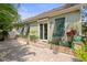 Lovely patio with sliding glass door, stylish awnings, and beautiful greenery at 7615 S Fitzgerald St, Tampa, FL 33616