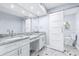 Bright bathroom features dual sinks, granite countertops and modern sliding barn door at 8238 30Th N Ave, St Petersburg, FL 33710
