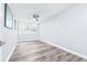 Bedroom with wood-look floors, a ceiling fan, and a double window providing lots of natural light at 8238 30Th N Ave, St Petersburg, FL 33710