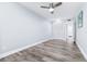 This bedroom features wood-look floors, a ceiling fan, and a closet at 8238 30Th N Ave, St Petersburg, FL 33710