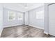 This bedroom offers wood-look floors, a ceiling fan, and two windows for lots of natural light at 8238 30Th N Ave, St Petersburg, FL 33710