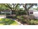 Home featuring mature landscaping, a stone facade, and a brick driveway at 8238 30Th N Ave, St Petersburg, FL 33710