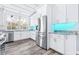 Bright kitchen boasts stainless steel appliances, granite counters and mosaic tile backsplash at 8238 30Th N Ave, St Petersburg, FL 33710