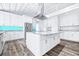 Bright kitchen with an expansive island, stainless steel appliances, and a striking blue backsplash at 8238 30Th N Ave, St Petersburg, FL 33710