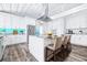 Spacious kitchen features a large center island with bar seating, stainless appliances, and white cabinetry at 8238 30Th N Ave, St Petersburg, FL 33710