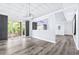 Open-concept living area with modern floors, natural light, and a view of outdoor foliage at 8238 30Th N Ave, St Petersburg, FL 33710