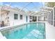 Screened-in pool area with refreshing blue water at 8238 30Th N Ave, St Petersburg, FL 33710