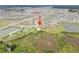 Expansive aerial shot of the property showing its location in a community with water features and green spaces at 8598 Parsons Hill Blvd, Wesley Chapel, FL 33545