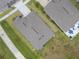 Aerial view of the roof and backyard with patio furniture of a well-maintained home at 8598 Parsons Hill Blvd, Wesley Chapel, FL 33545