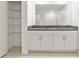 Bathroom featuring double sinks, granite countertops, white cabinets, and tile flooring at 8598 Parsons Hill Blvd, Wesley Chapel, FL 33545