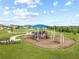 Community playground with slides, swings, and a covered picnic area set in a well-maintained green space at 8598 Parsons Hill Blvd, Wesley Chapel, FL 33545