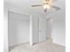 Spacious walk-in closet with wire shelving, neutral walls, and carpet flooring at 8598 Parsons Hill Blvd, Wesley Chapel, FL 33545