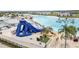 Large water slide and recreational facilities in a community lagoon setting with clear water and modern amenities at 8598 Parsons Hill Blvd, Wesley Chapel, FL 33545