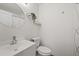 Bathroom featuring a modern sink, toilet, and decorative shelving for a clean and organized space at 8724 Mallard Reserve Dr # 101, Tampa, FL 33614
