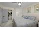 Comfortable bedroom with walk-in closet, ensuite bathroom, a queen bed and ceiling fan at 8724 Mallard Reserve Dr # 101, Tampa, FL 33614