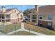 Scenic view of condominium complex with tennis court, lush landscaping, and building exteriors at 8724 Mallard Reserve Dr # 101, Tampa, FL 33614