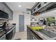 Bright kitchen with an island, dark countertops, gray cabinets, and stainless steel appliances at 8724 Mallard Reserve Dr # 101, Tampa, FL 33614