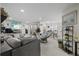Bright living room with tile floors, ample seating, and open floor plan at 8724 Mallard Reserve Dr # 101, Tampa, FL 33614