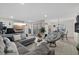 Inviting living room showcasing tile flooring, open layout, comfortable seating and an adjacent dining area at 8724 Mallard Reserve Dr # 101, Tampa, FL 33614