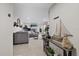 Open concept living room with tile floors, comfortable seating, and stylish decor at 8724 Mallard Reserve Dr # 101, Tampa, FL 33614