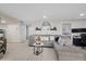 Comfortable living room with a plush gray sectional sofa and tile floors at 8724 Mallard Reserve Dr # 101, Tampa, FL 33614