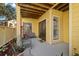 Cozy covered patio with seating, offering a relaxing outdoor space for enjoying the surroundings at 8724 Mallard Reserve Dr # 101, Tampa, FL 33614