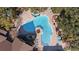 Overhead view of a sparkling community pool featuring lounge chairs and landscaped surroundings at 8724 Mallard Reserve Dr # 101, Tampa, FL 33614