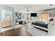 Cozy bedroom features a modern design, en-suite bathroom, hardwood floors, and lots of natural light at 90 Bahama Cir, Tampa, FL 33606