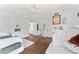 Spacious bedroom features hardwood floors, modern decor, lots of natural light, and en-suite bathroom access at 90 Bahama Cir, Tampa, FL 33606