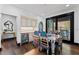 Bright dining area with a painted table, modern cabinets, and outdoor access at 90 Bahama Cir, Tampa, FL 33606