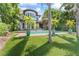 A picturesque facade with lush landscaping complements this home's unique architectural style at 90 Bahama Cir, Tampa, FL 33606